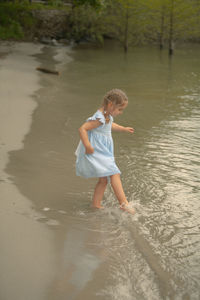 Full length of girl on beach