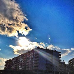 Low angle view of building against cloudy sky