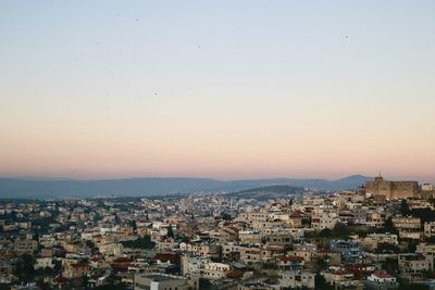 High angle view of townscape against sky during sunset