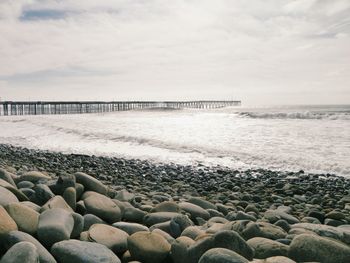 Scenic view of sea against cloudy sky