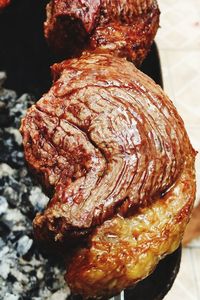 High angle view of meat on barbecue grill