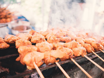 Close-up of meat cooking on barbecue grill