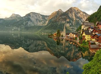 Scenic view of lake and mountains against sky