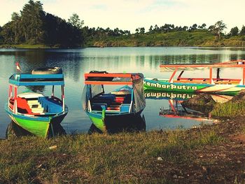 Boats in calm lake