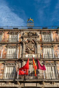 Low angle view of building against cloudy sky