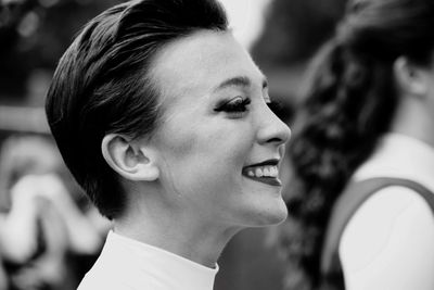 Close-up portrait of a young woman looking away