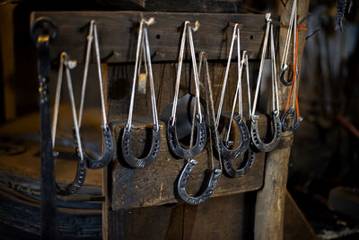 Blacksmith decorative horseshoes elements hanging at forge. handmade and craftsmanship 