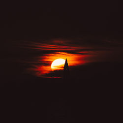 Close-up of silhouette against orange sky during sunset