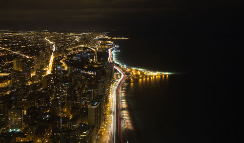 Aerial view of illuminated cityscape at night