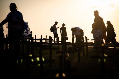 Silhouette people at sunset