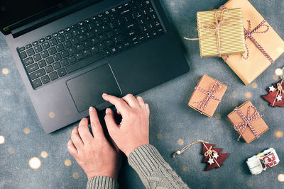 High angle view of woman using laptop on table