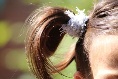 Cropped image of girl with pigtail