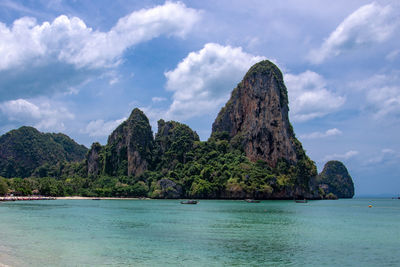 Scenic view of sea and rock formation against sky