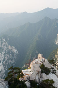 Panoramic view of buildings and mountains against sky