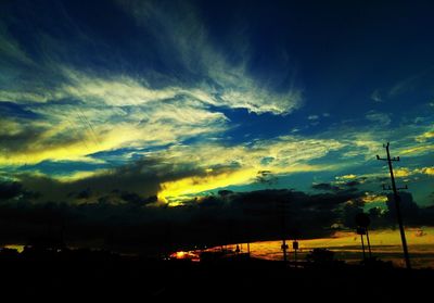 Silhouette of car at sunset