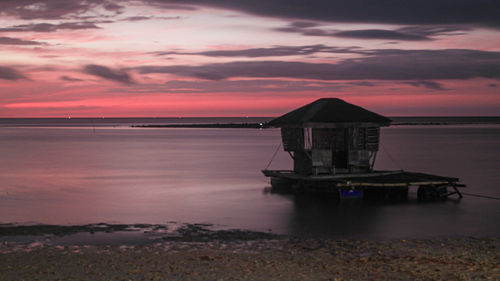 Scenic view of sea against sky at sunset