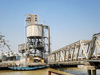 View of factory against blue sky