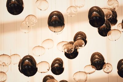 Low angle view of bubbles flying against ceiling