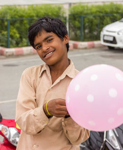 Portrait of happy boy with balloons