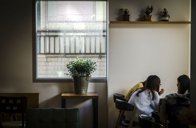 View of group of friends talking