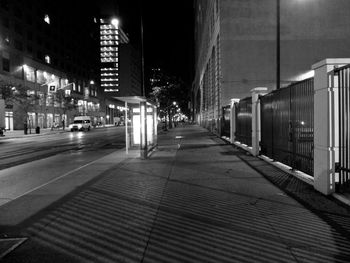 Illuminated city against sky at night