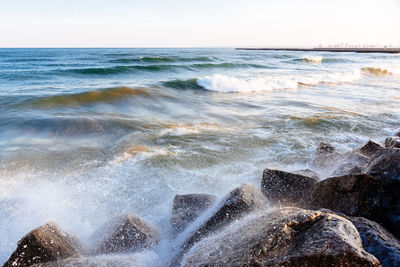 Close-up of waves in sea against sky