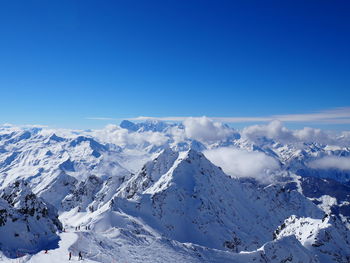 Scenic view of snow covered mountains against sky