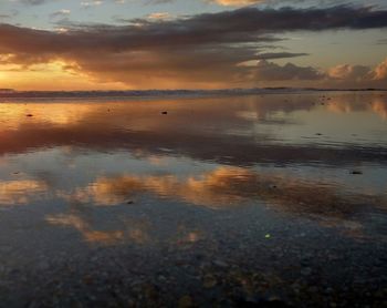 Scenic view of sea against sky at sunset