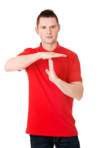 Portrait of man gesturing while standing against white background