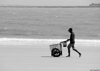 Full length of man walking on beach