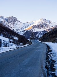 Scenic view of snowcapped mountains against clear sky