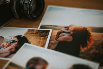 Midsection of woman photographing food on table