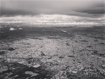 Aerial view of cityscape against sky