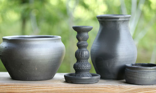 Close-up earthenware on table outdoors