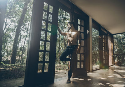 Man standing by window