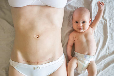 Midsection of shirtless baby