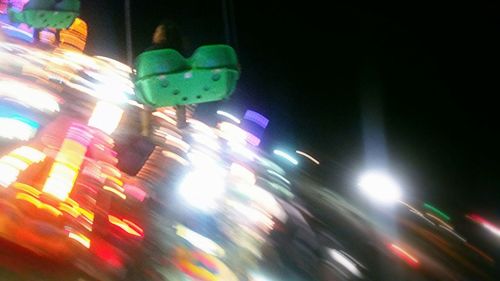 Blurred motion of car on road at night