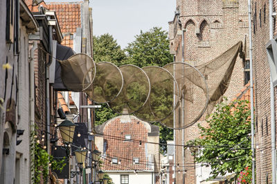 Fishing nets above street in old town