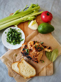 High angle view of fruits and vegetables on cutting board