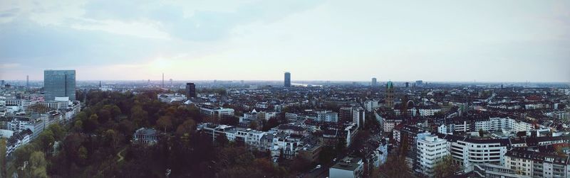 High angle view of city buildings against sky