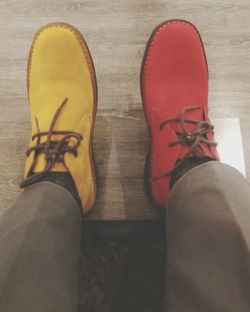 Low section of man standing on floor