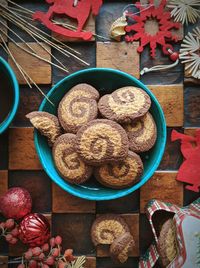 High angle view of cookies in bowl with christmas decoration on table