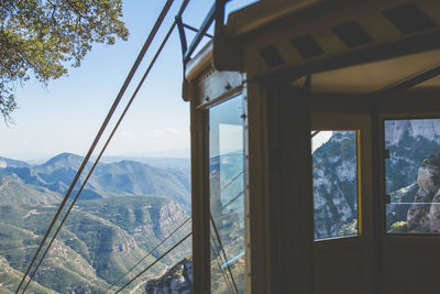 Overhead cable car station against mountains