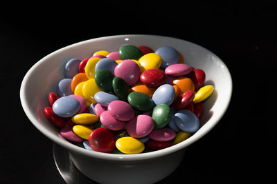 Close-up of colorful candies in bowl