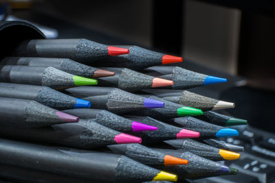 Close-up of multi colored pencils on table