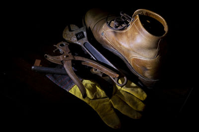 High angle view of metal on table against black background