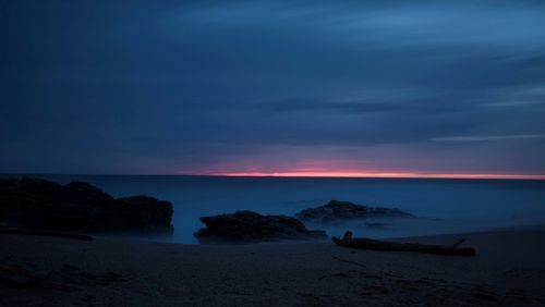 Scenic view of sea against sky at sunset