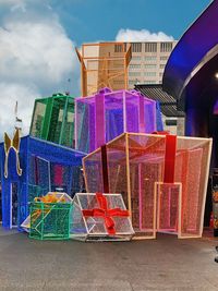 Multi colored buildings in city against sky