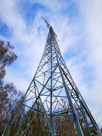 Low angle view of communications tower against sky