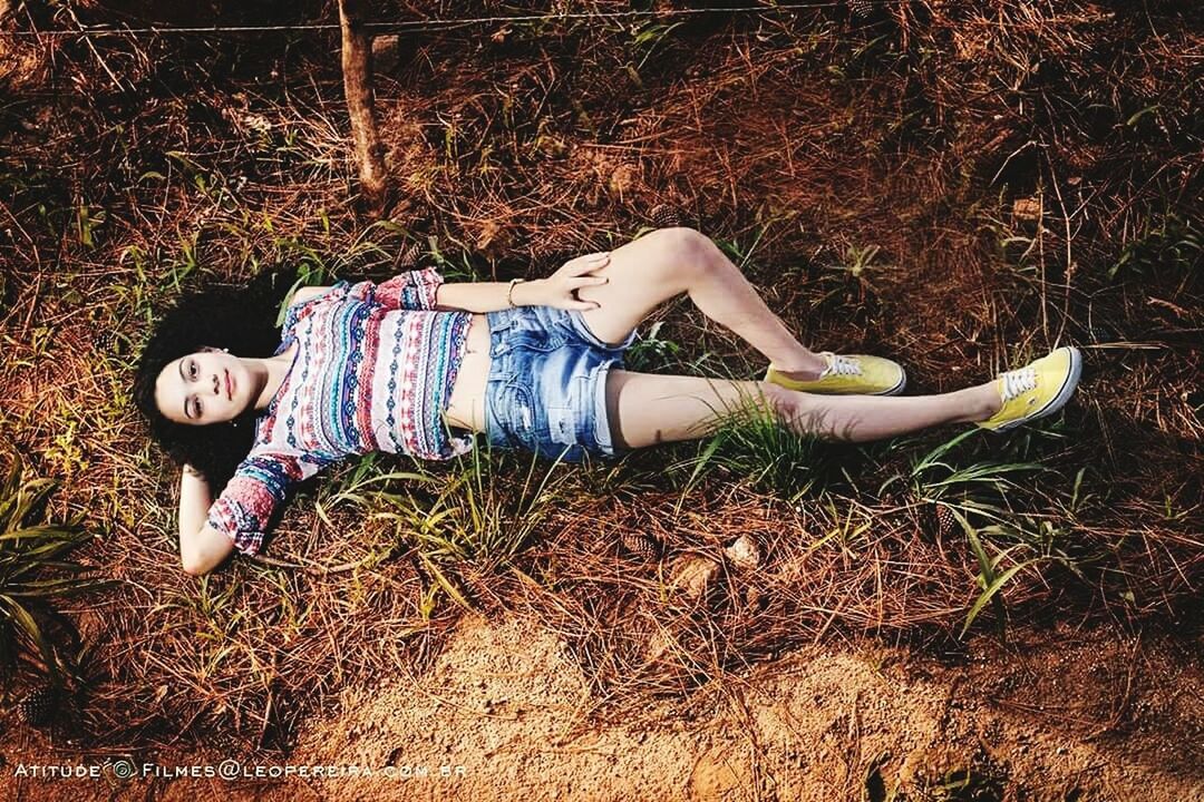 DIRECTLY ABOVE VIEW OF BOY LYING ON GRASS